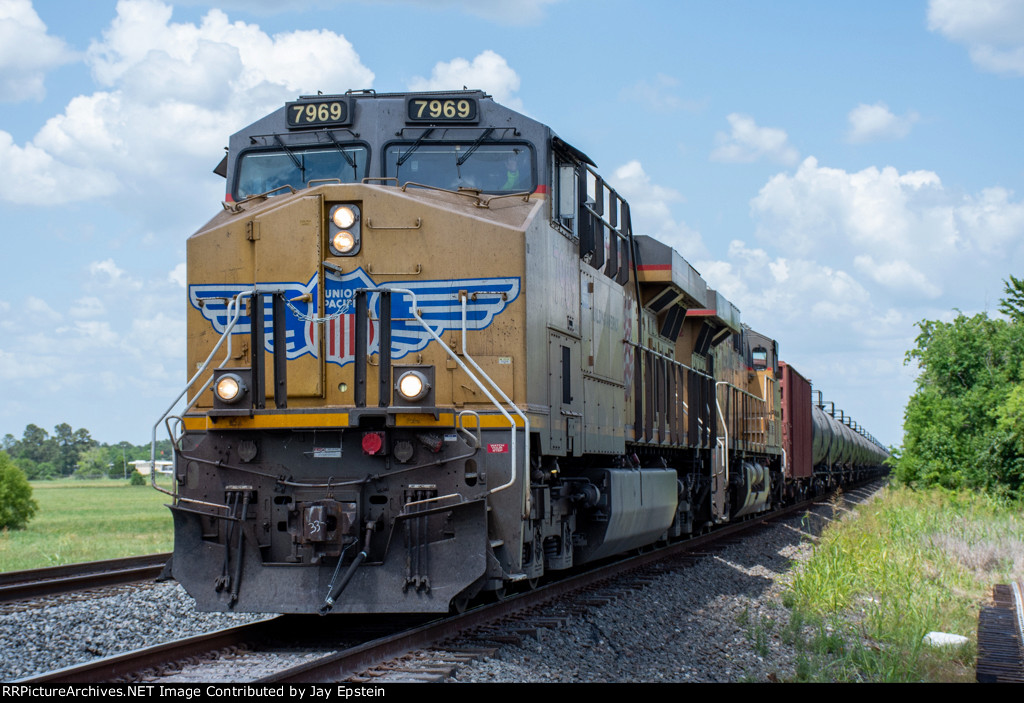 A unit tank car train rolls west on the Houston Sub